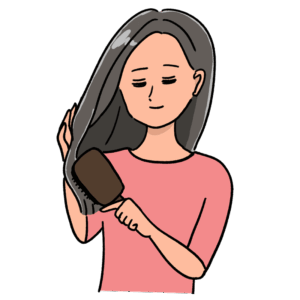 髪をとかす女性のイラスト